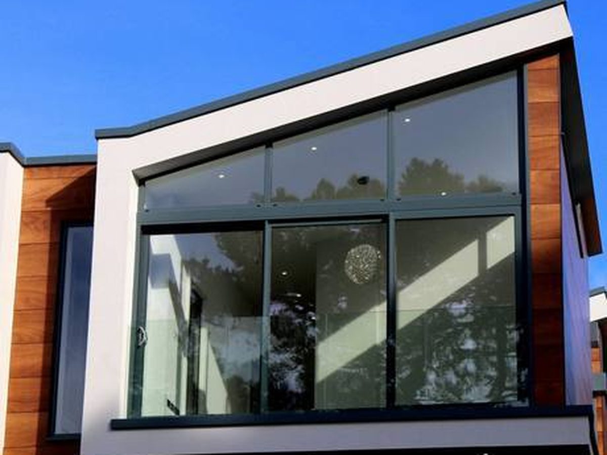 White render combined with timber cladding and glazing on a modern home