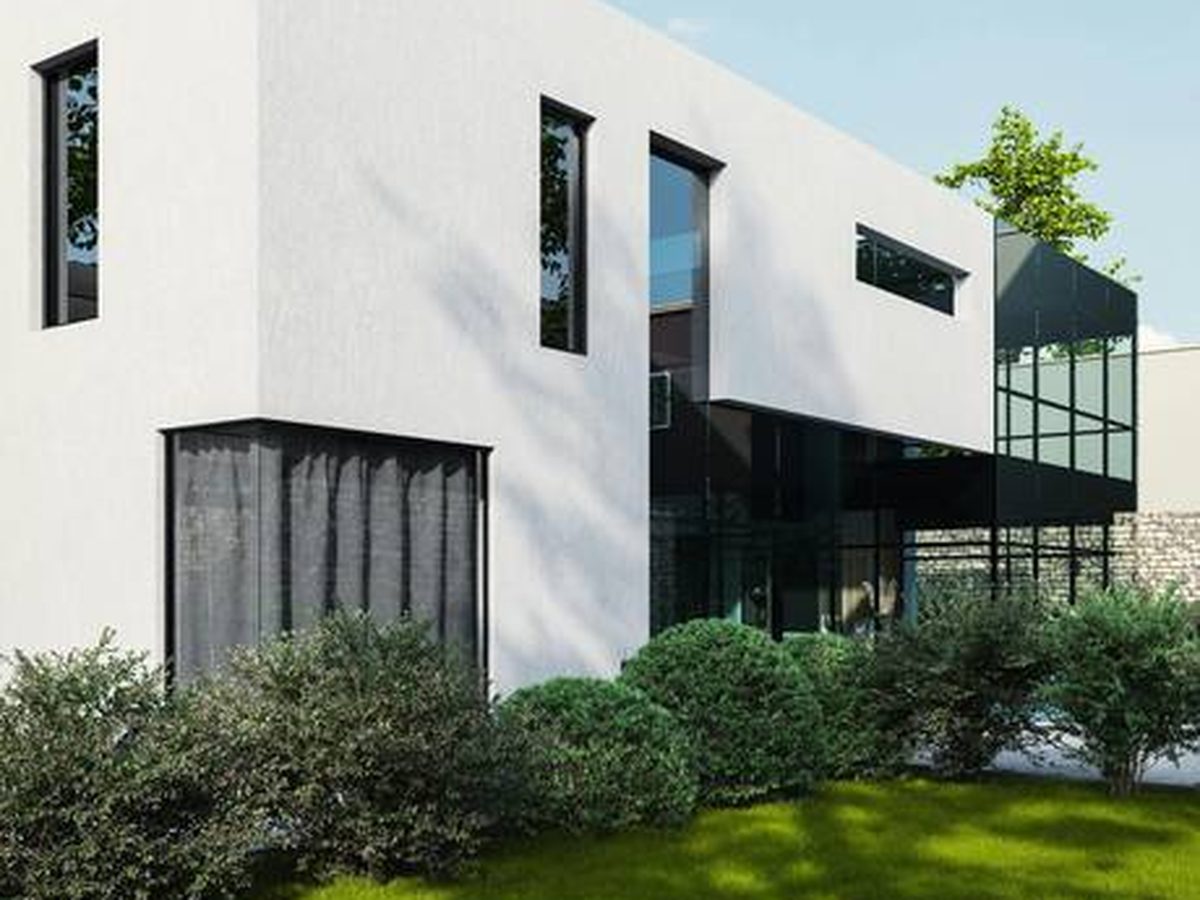 A crisp, smooth white render on a modern house &mdash; smooth finishes show colour at its brightest and flattest