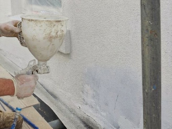 Sprayed cork render coating on a UK home